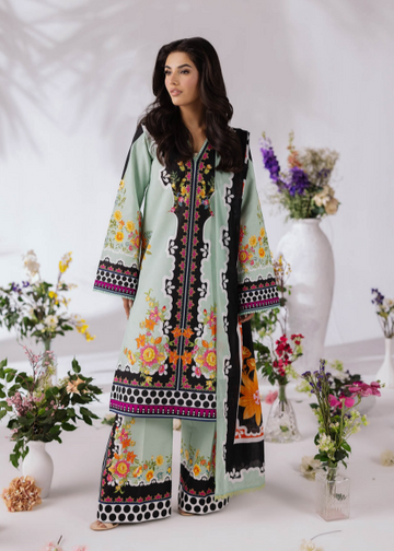 Woman wearing a light green embroidered outfit with flowers in the background