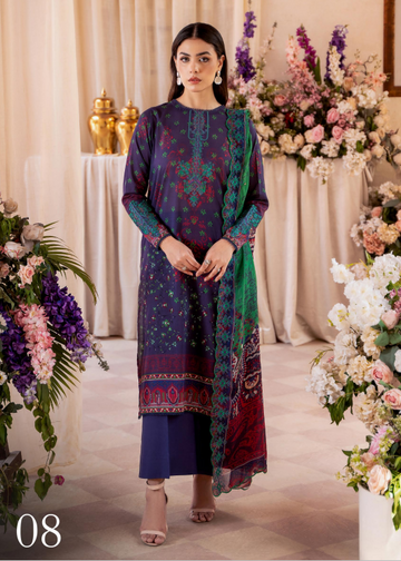 Woman in a colorful traditional outfit standing in front of floral decorations