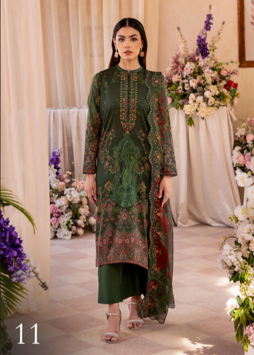 Woman in a green embroidered dress standing in front of floral decorations