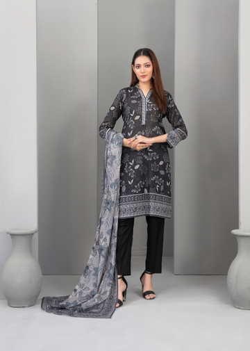 Woman wearing a dark gray traditional outfit with a matching dupatta against a plain background