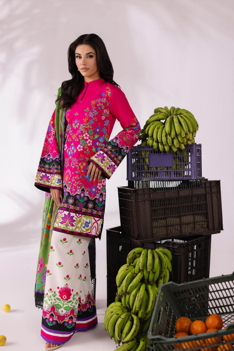 Woman in a colorful traditional outfit standing next to crates of bananas and oranges on a white background