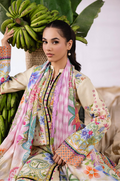 Woman in a colorful traditional outfit holding a bunch of bananas with a leafy background