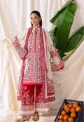 Woman wearing a red and white embroidered traditional outfit with a white curtain and green leaves in the background.