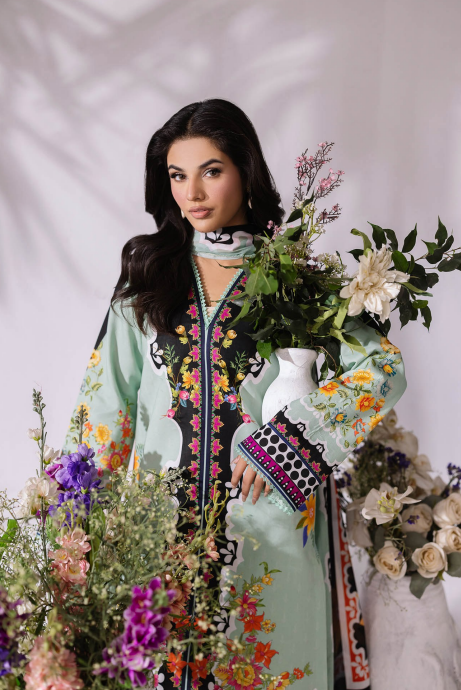 Woman in a traditional outfit surrounded by flowers against a white background