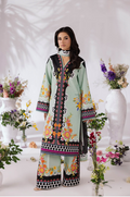 Woman wearing a traditional outfit with floral patterns in a decorated setting with flowers and vases.