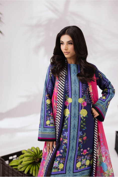 Woman wearing a colorful embroidered outfit with a white background