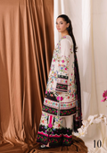 Woman wearing a traditional embroidered outfit with a white background
