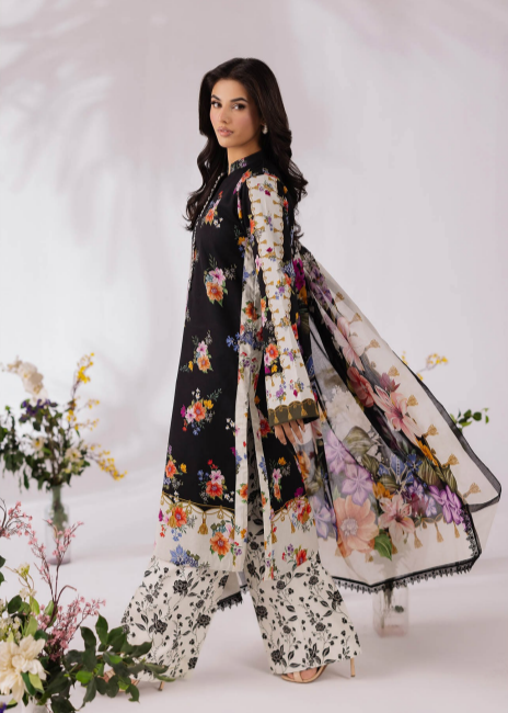 Woman wearing a floral dress with a matching dupatta on a white background