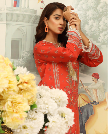 Woman in a red embroidered outfit with flowers and a decorative background