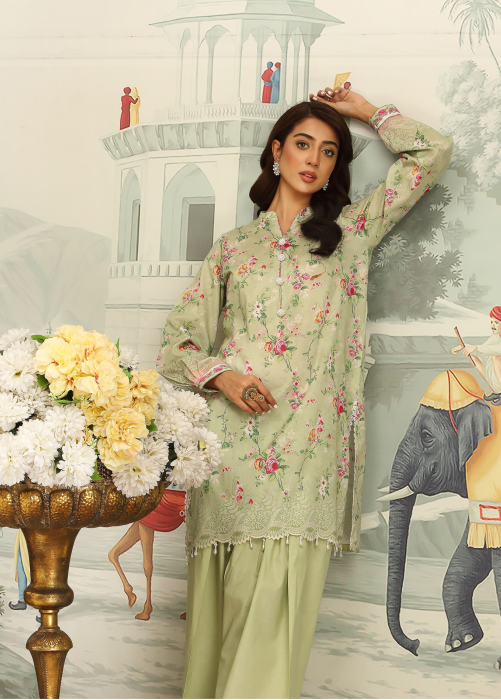 Woman in a light green floral outfit standing in front of an illustrated background with flowers and an elephant.
