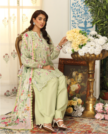 Woman in a floral outfit sitting in a decorated room with flowers and decorative elements.