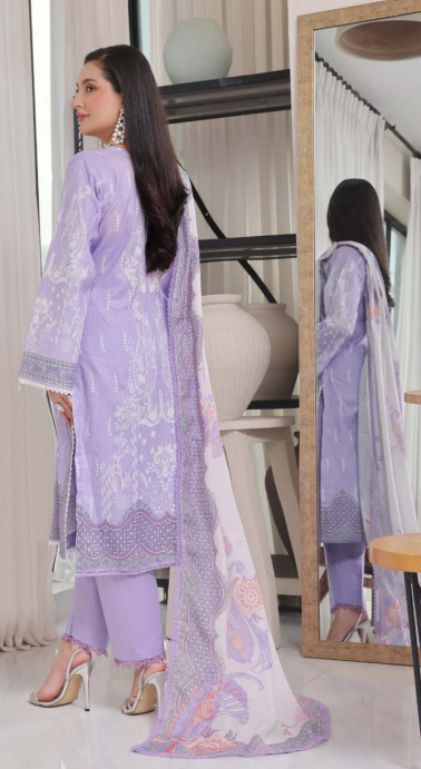 Woman in a lavender traditional outfit with a matching dupatta, standing in front of a mirror.