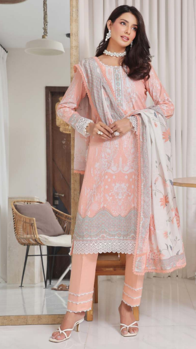 Woman in a pink and gray traditional outfit sitting indoors.