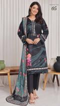 Woman wearing a black and floral dress with a matching dupatta in a minimalistic setting.