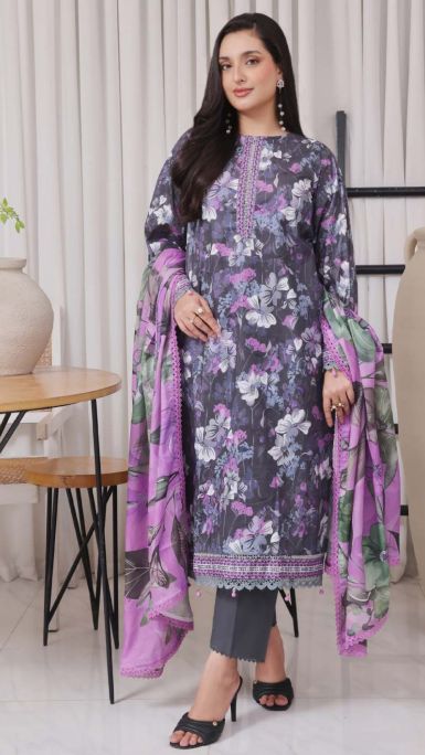 Woman wearing a floral dress with a purple dupatta in a minimal indoor setting