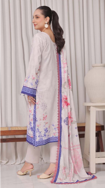 Woman wearing a white embroidered outfit with a floral dupatta in a minimalistic setting.