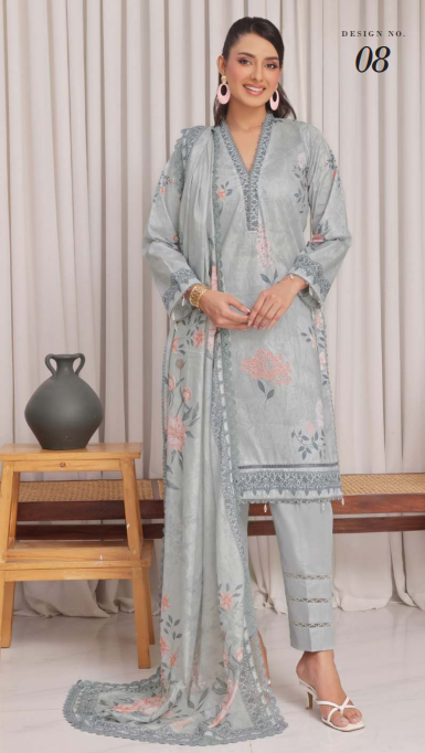 Woman wearing a light blue embroidered outfit with a matching dupatta in a minimalistic setting.
