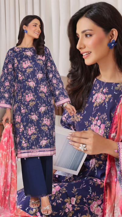 Woman wearing a floral dress with a pink dupatta, holding a book.