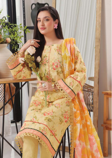 Woman in a floral dress with a matching dupatta in a bright indoor setting