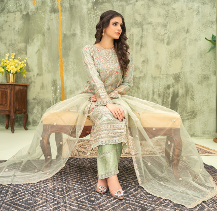 Woman in traditional outfit sitting on a bench with a textured wall background