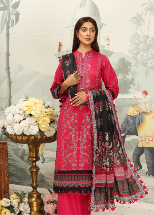 Woman wearing a red and black embroidered traditional outfit with a decorative background.