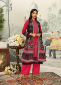 Woman in traditional outfit with floral patterns in a decorative setting
