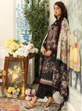 Woman in traditional attire standing in a decorated room with flowers and artwork.