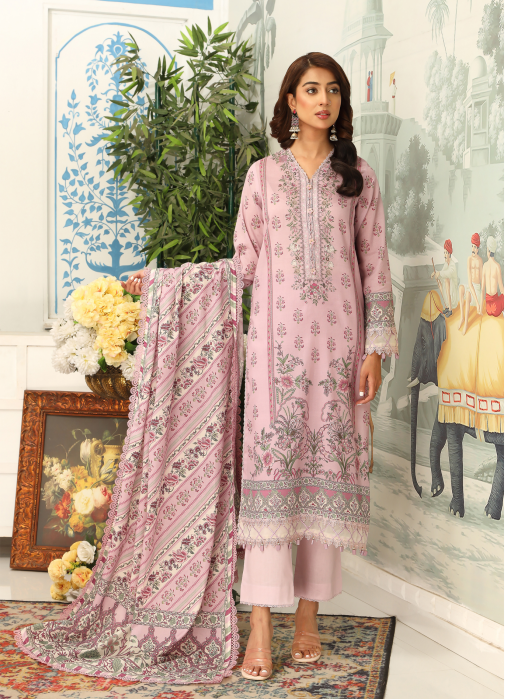 Woman in a pink embroidered outfit with a matching dupatta in a decorated room.