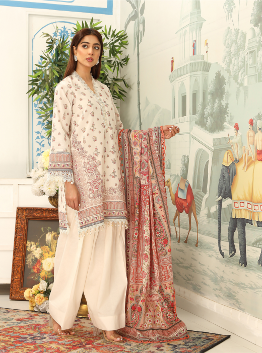 Woman in traditional attire with a patterned scarf in a decorated room.