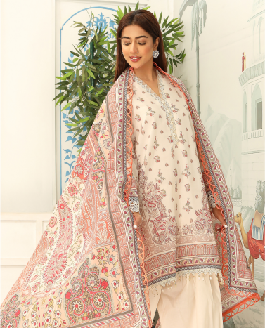 Woman wearing a traditional outfit with a floral shawl in an outdoor setting