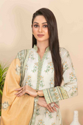 Woman wearing a traditional outfit with a beige and green patterned design.
