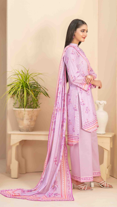 Woman in a pink traditional outfit with a matching dupatta in a minimalistic setting.