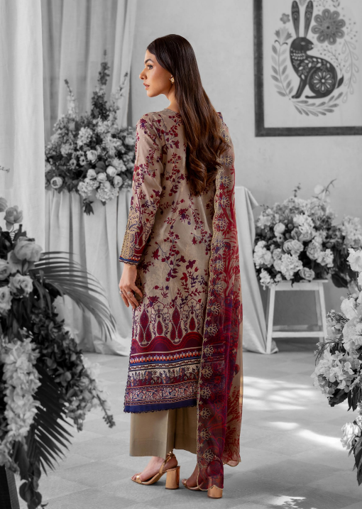 Woman in a floral dress standing in a decorated room with flowers and a rabbit illustration.