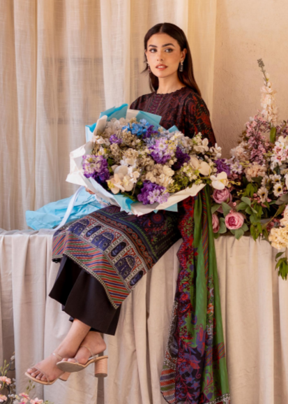 Woman holding a bouquet of flowers with a floral arrangement in the background