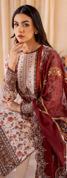 Woman wearing a traditional embroidered outfit with a red shawl.