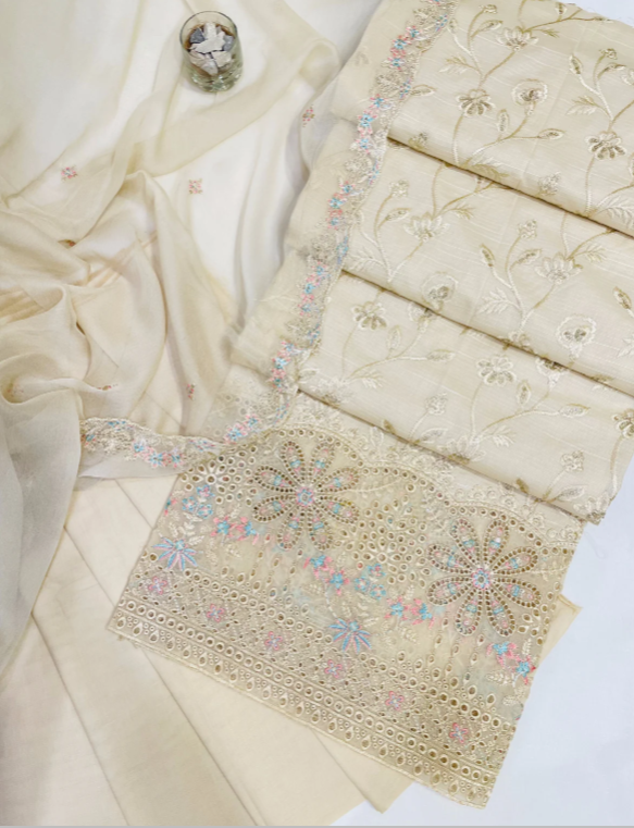 Elegant beige fabric with intricate beadwork on a white background